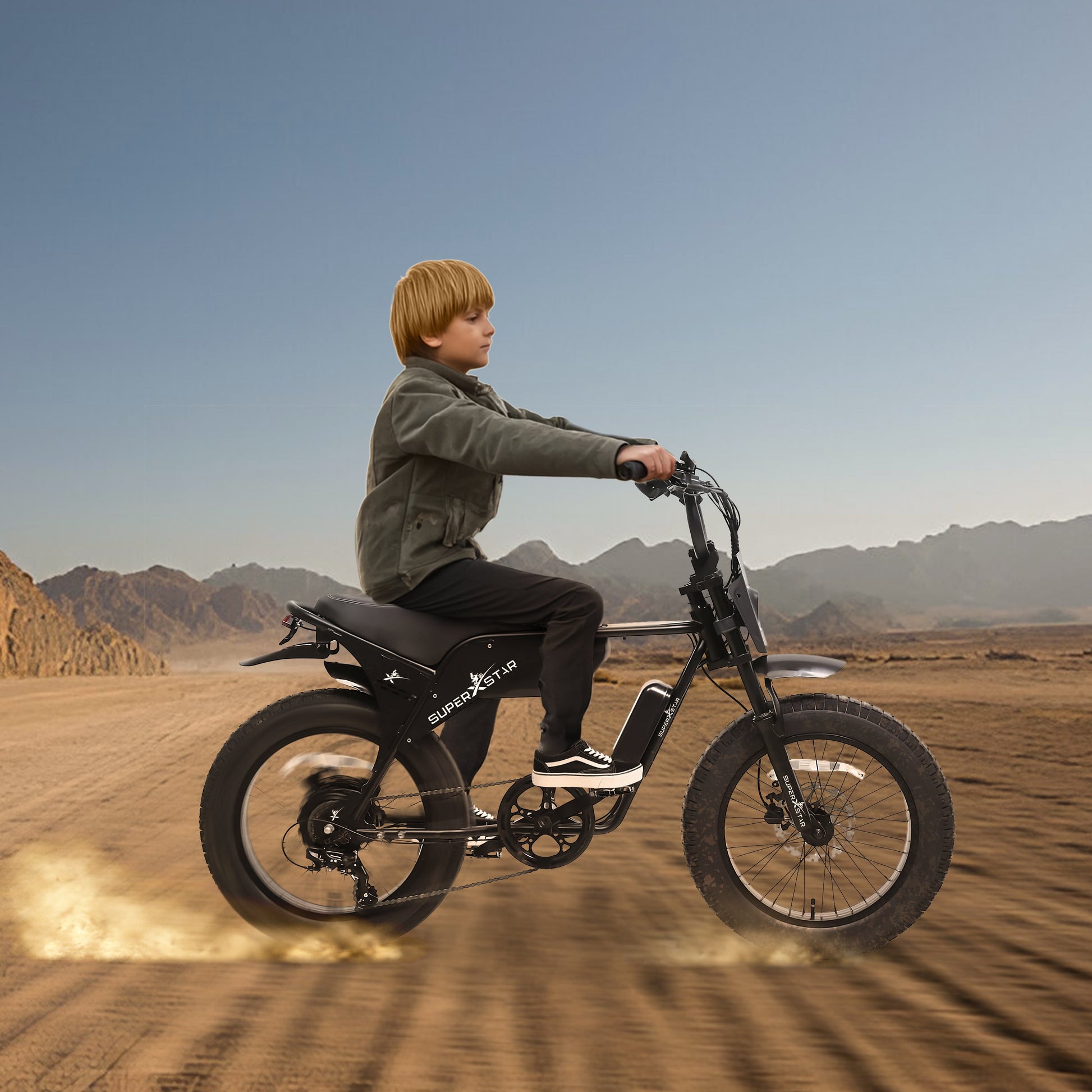 Child riding Super X Star E Times JR 750W electric bike across desert terrain